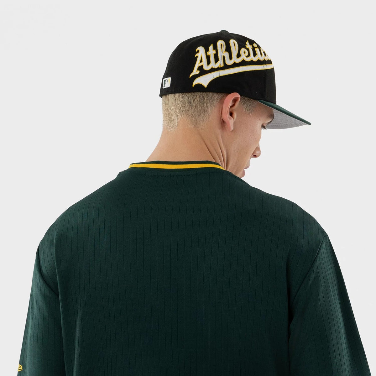 The model is wearing this MLB Athletics Oversized T-Shirt in dark green. 7