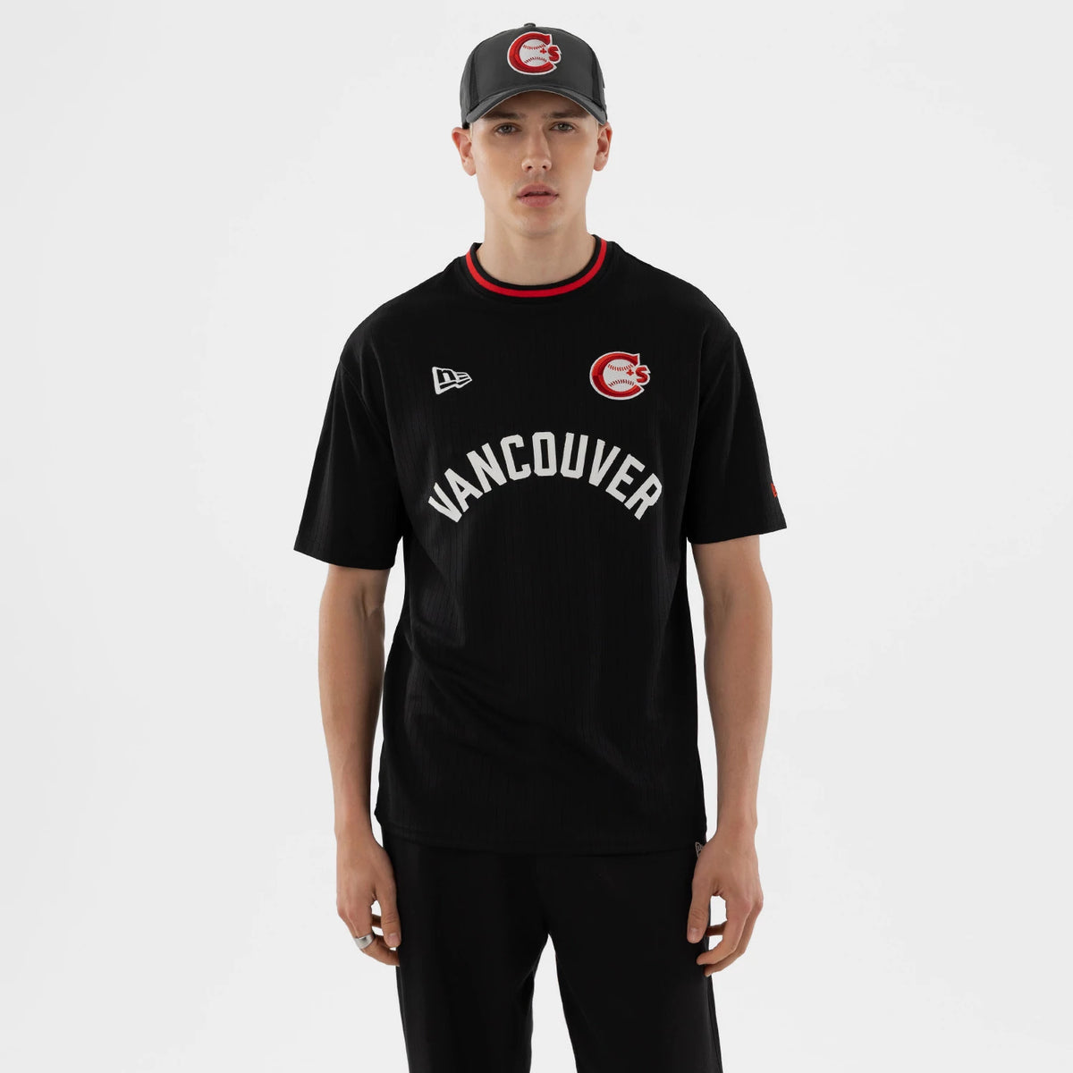 The model is wearing this MiLB Vancouver Canadians Oversized T-Shirt in black. 1