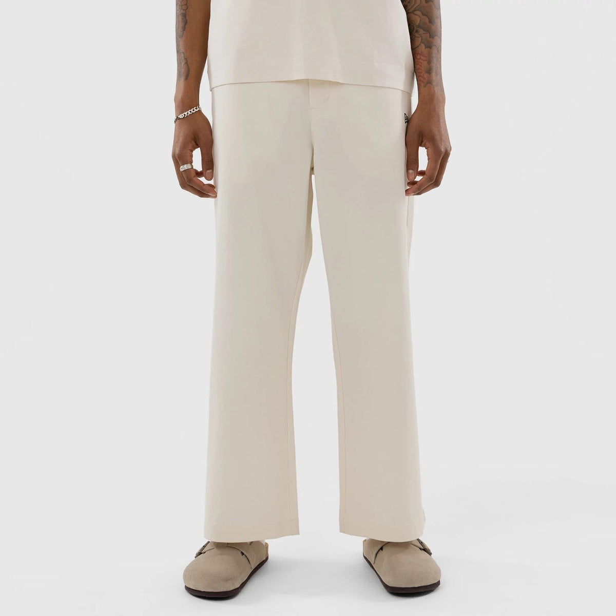 The model is wearing this MLB New York Yankees Chino Trousers in Cream. 1