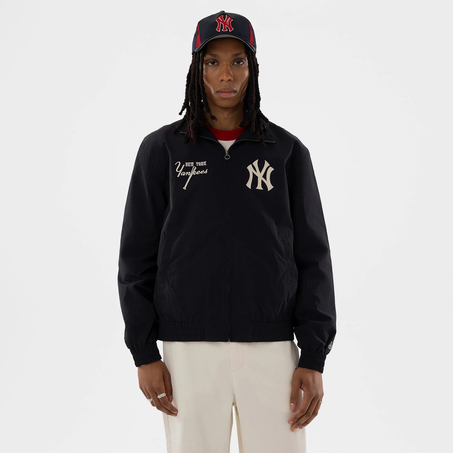 The model is wearing this MLB New York Yankees Sports Jacket in navy. 1