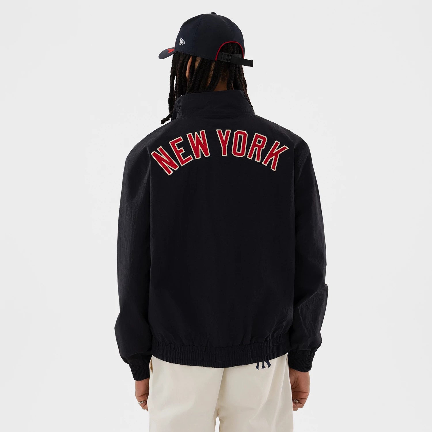 The model is wearing this MLB New York Yankees Sports Jacket in navy. 2