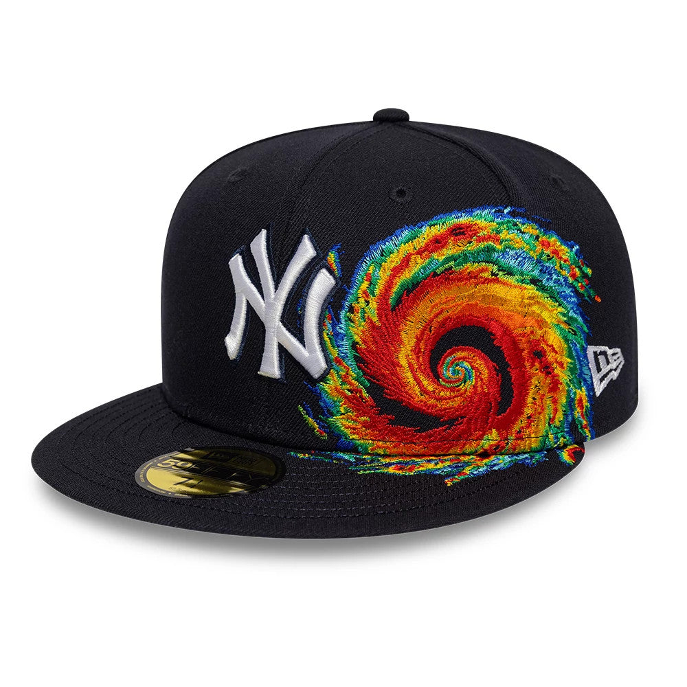 New York Yankees MLB Storm Pattern Navy New Era 59FIFTY Fitted Cap, front view showing the white raised embroidered NY logo on the front panel, a multicoloured storm pattern on the side, and a gold 59FIFTY size sticker on the black flat visor.