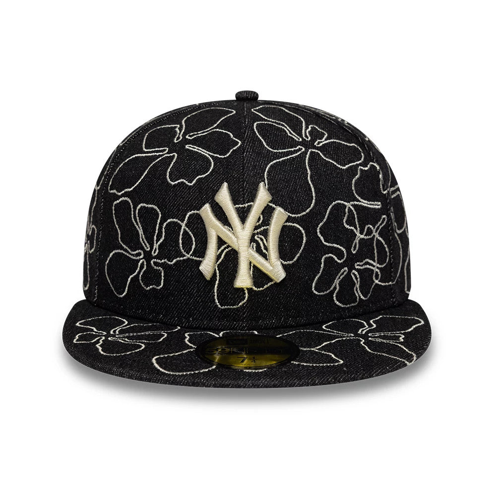 New York Yankees MLB Floral Denim Black New Era 59FIFTY Fitted Cap, front view showing the cream embroidered NY logo on the front panel, floral line patterns across the black denim fabric, and a gold 59FIFTY size sticker on the flat visor.