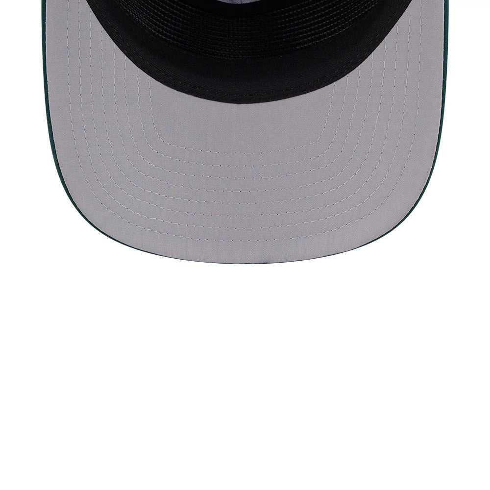 New Era Golf Dark Green 19TWENTY Adjustable Cap, inside view showing the grey undervisor with black lining, detailed stitching on the panels, and a glimpse of the dark sweatband inside the structured crown.