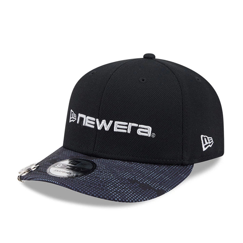New Era Golf Black 9FIFTY Snapback Adjustable Cap, three-quarter view showing the raised white embroidered New Era lettering on the front panel, a speckled black and grey flat visor with a 9FIFTY size sticker.