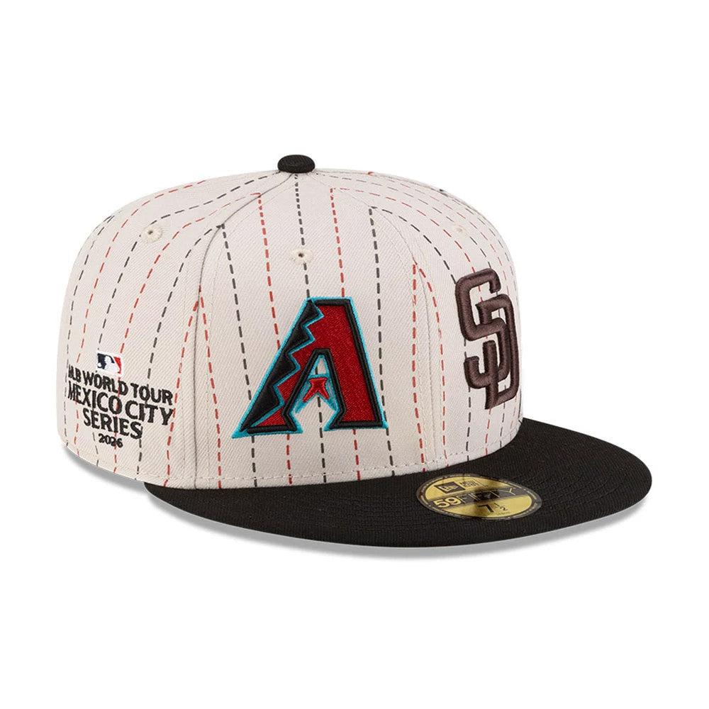 Dueling League MLB Mexico City Series 2026 Light Beige New Era 59FIFTY Fitted Cap, three-quarter view showing embroidered team logos including a red and teal A logo and brown SD logo on the front, with a black flat visor.