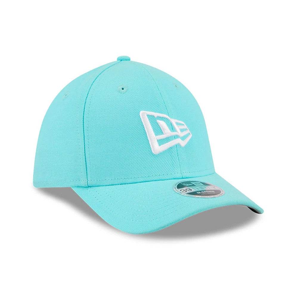 New Era Flag Pastel Blue New Era 39THIRTY M-Crown Stretch Fit Cap, three-quarter view showing the white raised embroidered New Era flag logo on the front panel, curved pastel blue visor, and 39THIRTY size sticker on the visor.