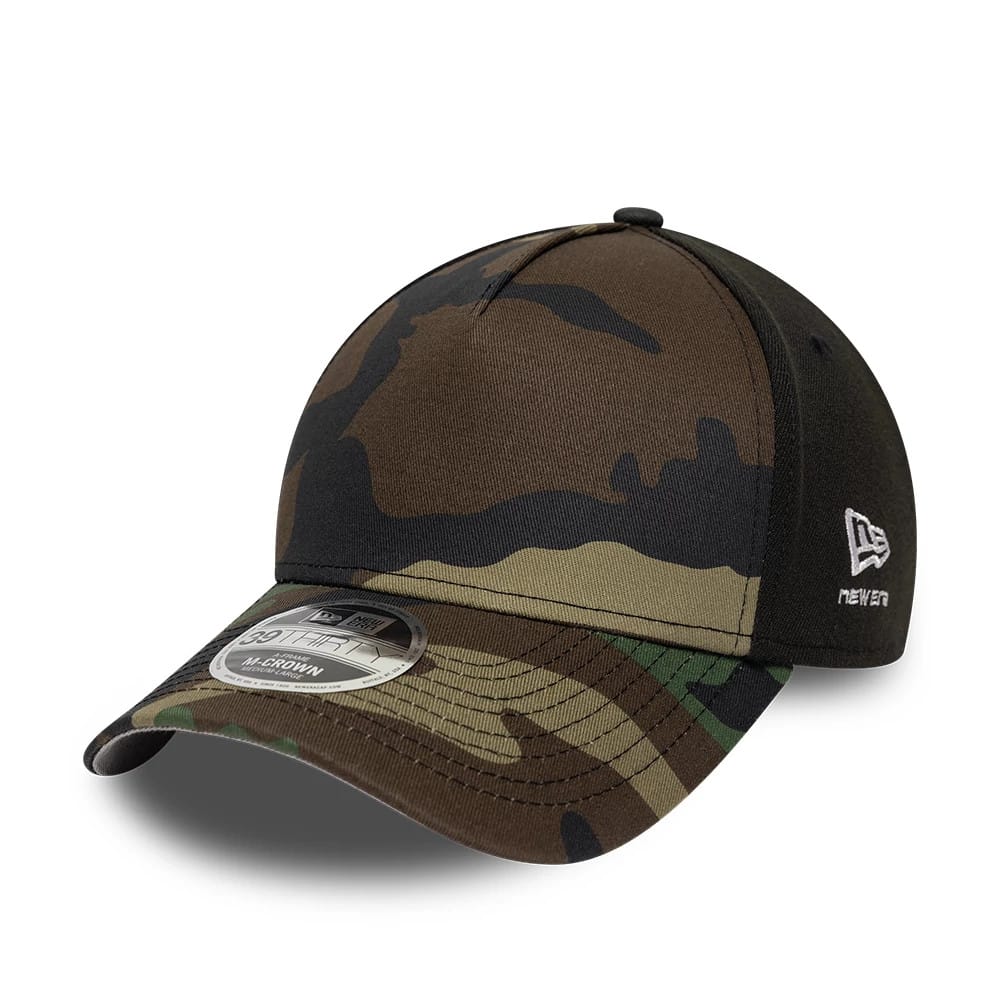 New Era Woodland Camo 39THIRTY M-Crown A-Frame Stretch Fit Cap, three-quarter view showing the curved woodland camo visor with a 39THIRTY size sticker, brown and green camouflage front panels, and white embroidered New Era flag logo on the left side.