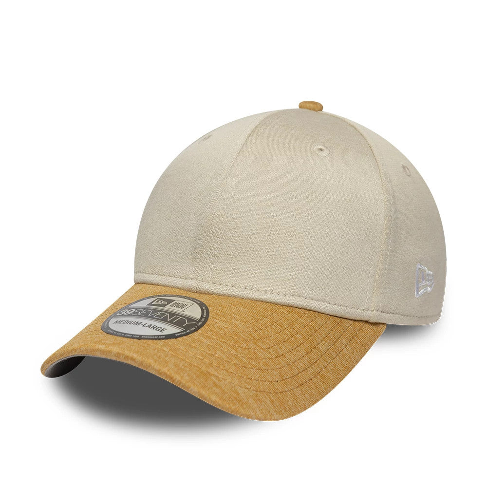 New Era 2 Tone Cream New Era 39SEVENTY Stretch Fit Cap, front view showing a raised white New Era flag logo on the left side, cream structured crown, brown curved visor, and a 39SEVENTY size sticker on the top of the visor.