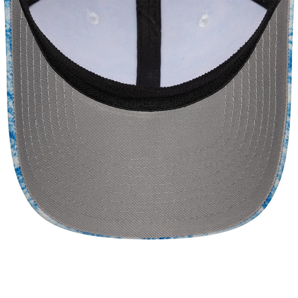 New Era Floral Blue 39SEVENTY Stretch Fit Cap, inside view showing a grey undervisor with neat stitching, black sweatband encircling the crown's edge, and contrasting white taping against the blue floral pattern of the outer fabric.