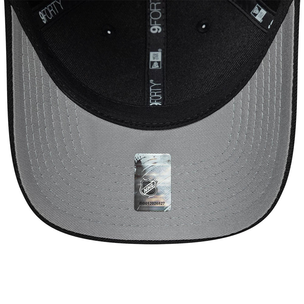 Boston Bruins NHL Team Black New Era 9FORTY M-Crown Adjustable Cap, inside view showing black 9FORTY taping along the seams, a grey undervisor with a centrally placed NHL sticker, and a snug-attached black sweatband.