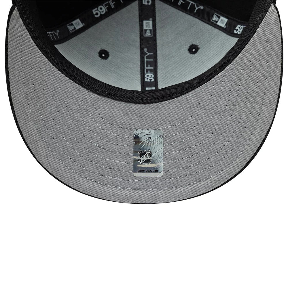 Dallas Stars NHL Basic Black New Era 59FIFTY Fitted Cap, inside view showing grey undervisor with an NHL logo sticker, black sweatband with white 59FIFTY branding and black taping with New Era and 59FIFTY logos.
