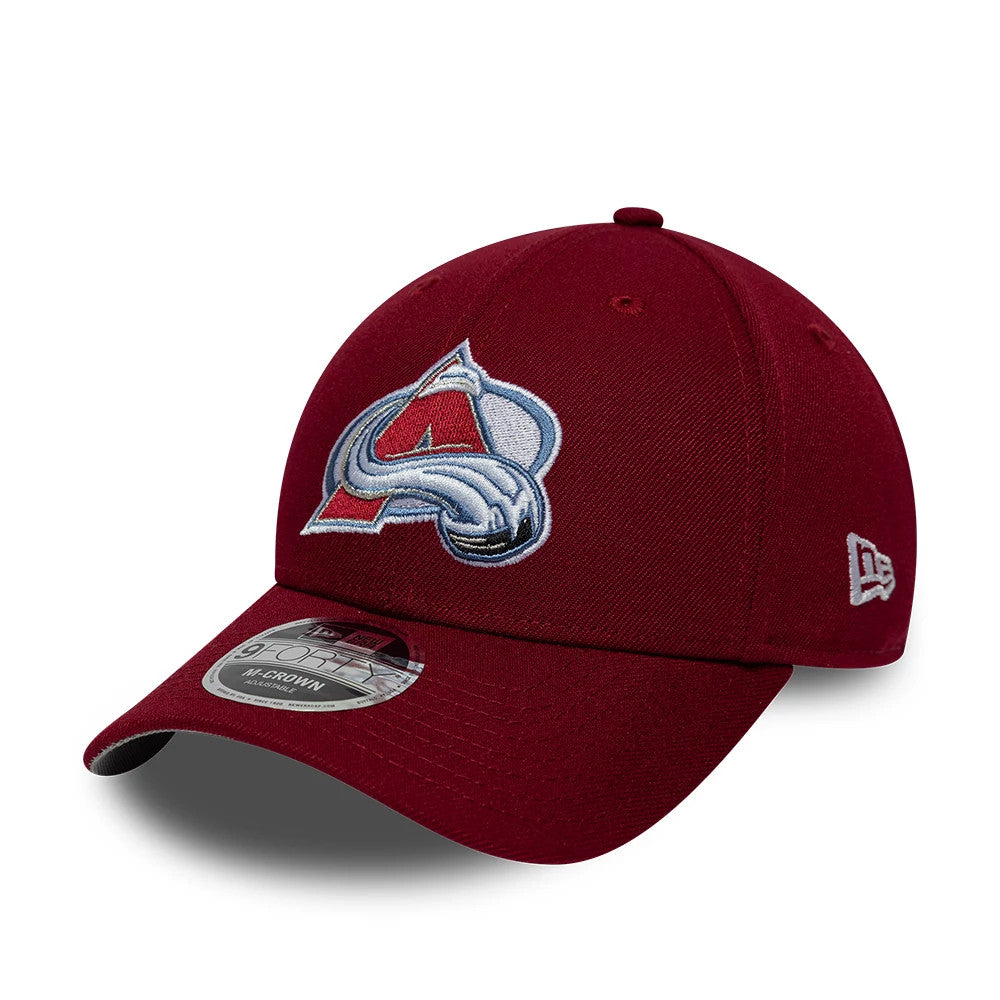 Colorado Avalanche NHL Team Dark Red New Era 9FORTY M-Crown Adjustable Cap, three-quarter view showing the raised embroidered team logo on the front panel, a curved visor with 9FORTY size sticker, and the New Era flag logo on the left side.