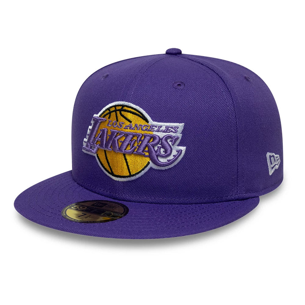 LA Lakers NBA Hardwood Classic Purple New Era 59FIFTY Fitted Cap, three-quarter view showing a raised Los Angeles Lakers logo in yellow and purple embroidery on the front panel, purple visor with a gold 59FIFTY size sticker.