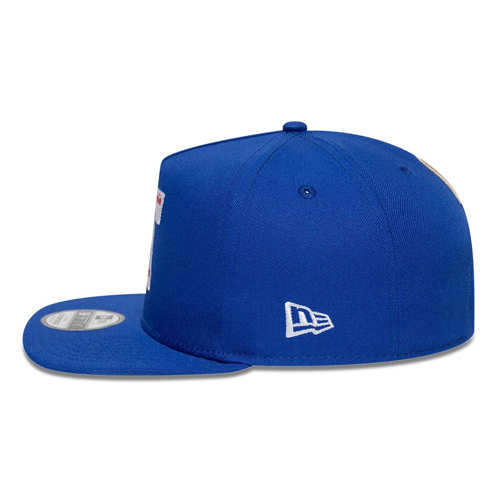 Philadelphia 76ers NBA Hardwood Classic Blue New Era 9FIFTY A-Frame Snapback Adjustable Cap, side view showing the white New Era flag logo on the deep blue crown with a flat blue visor and a 9FIFTY size sticker on top.