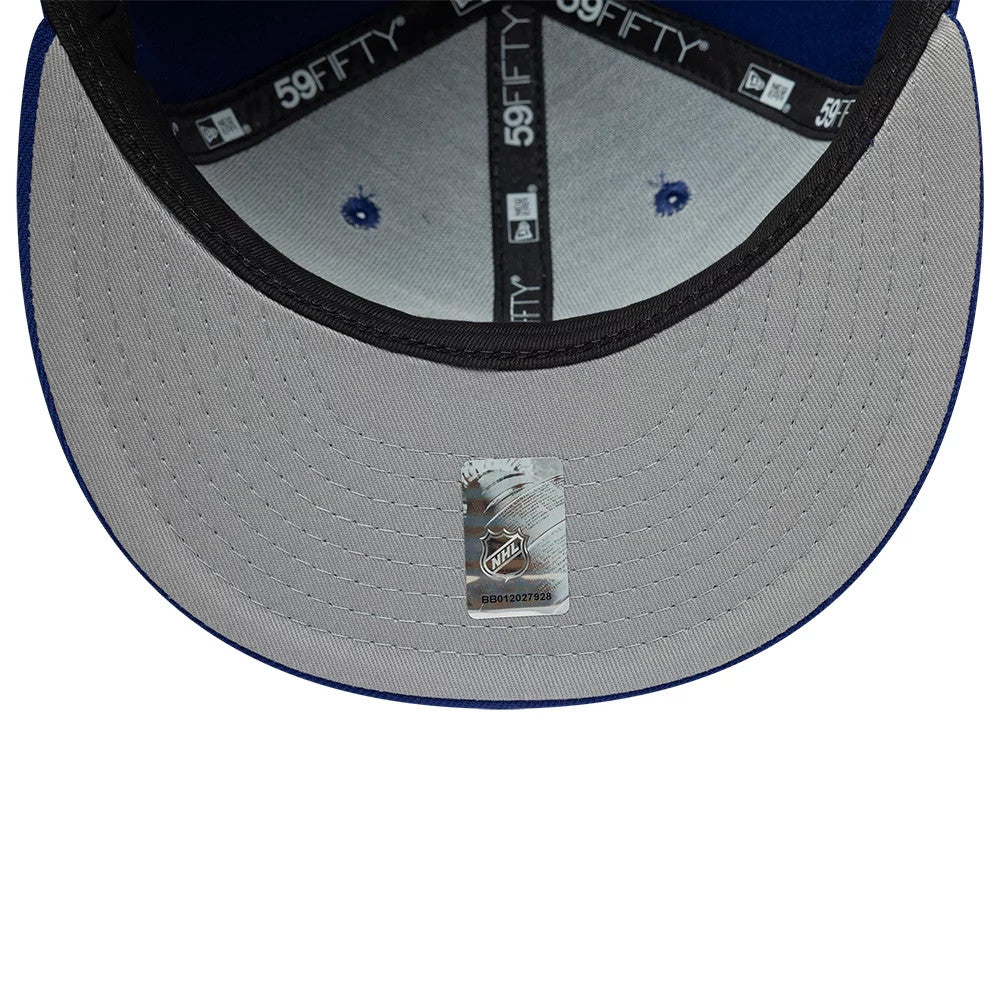 New York Rangers NHL Basic Blue New Era 59FIFTY Fitted Cap, inside view showing the grey undervisor with an NHL sticker, black sweatband and black 59FIFTY taping along the interior seams of the blue structured crown.