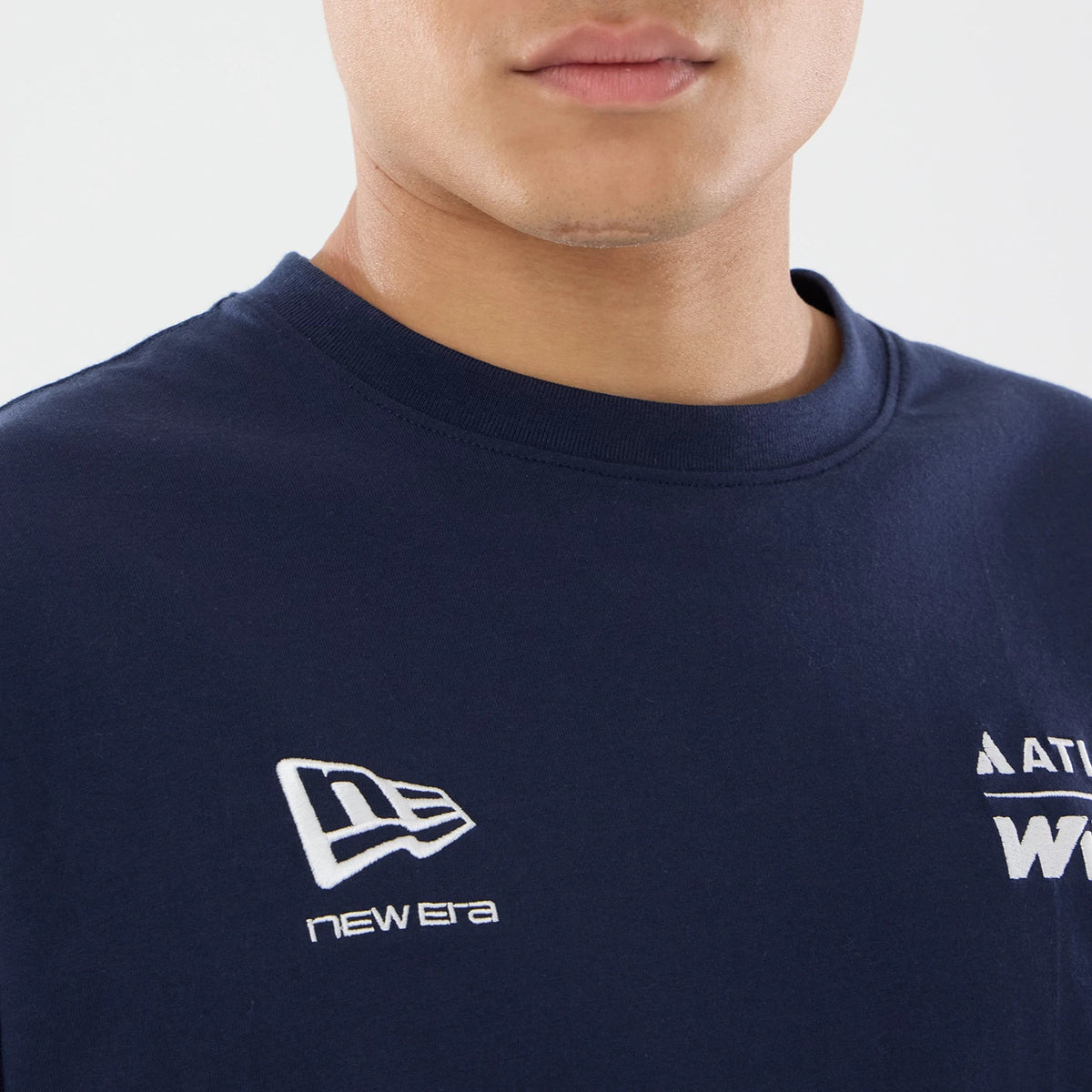 New Era Williams GB Race Special Navy T-Shirt, front view showing a navy short-sleeved shirt with an embroidered white New Era logo on the right chest, lettering on the left chest, and a close-up of a round neckline.