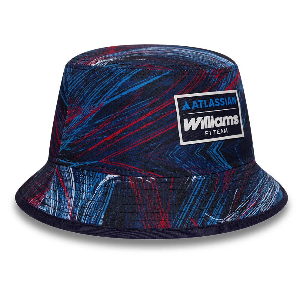 New Era Williams GB Race Special Navy Bucket Cap, front view showing an embroidered Williams F1 Team logo patch on the structured crown, with blue and red graphic patterns and a wide, soft navy visor.