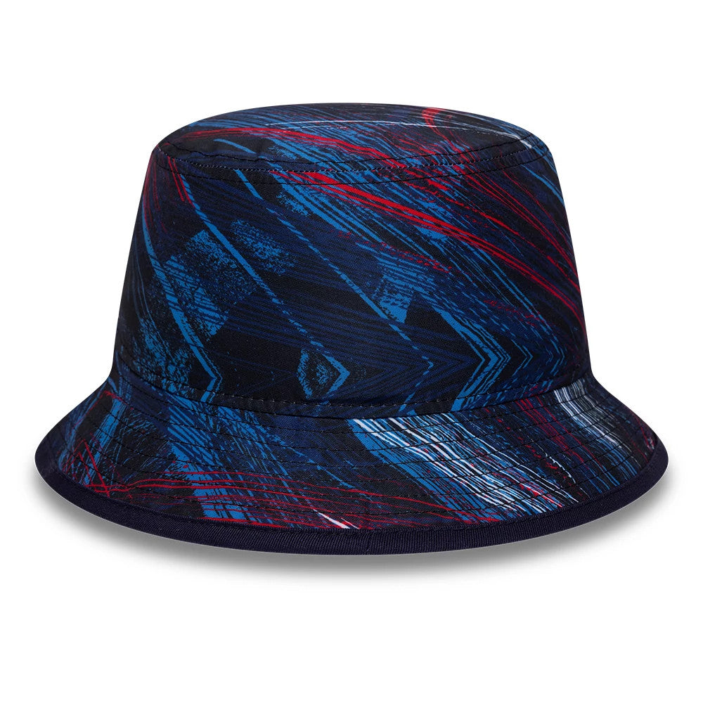 New Era Williams GB Race Special Navy Bucket Cap, front view showing a dynamic blue and red geometric print on the structured crown and visor, offering a racing-inspired design with a focus on lines and contrasting colours.