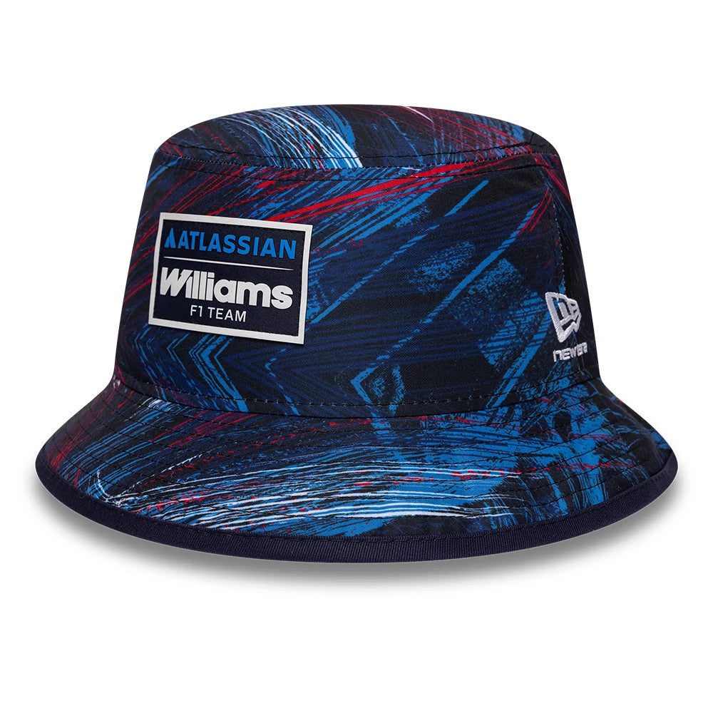 New Era Williams GB Race Special Navy Bucket Cap, front view showing the embroidered Atlassian Williams F1 Team patch on the navy patterned crown, with a geometric design in blue and red hues, and the New Era flag logo on the side.
