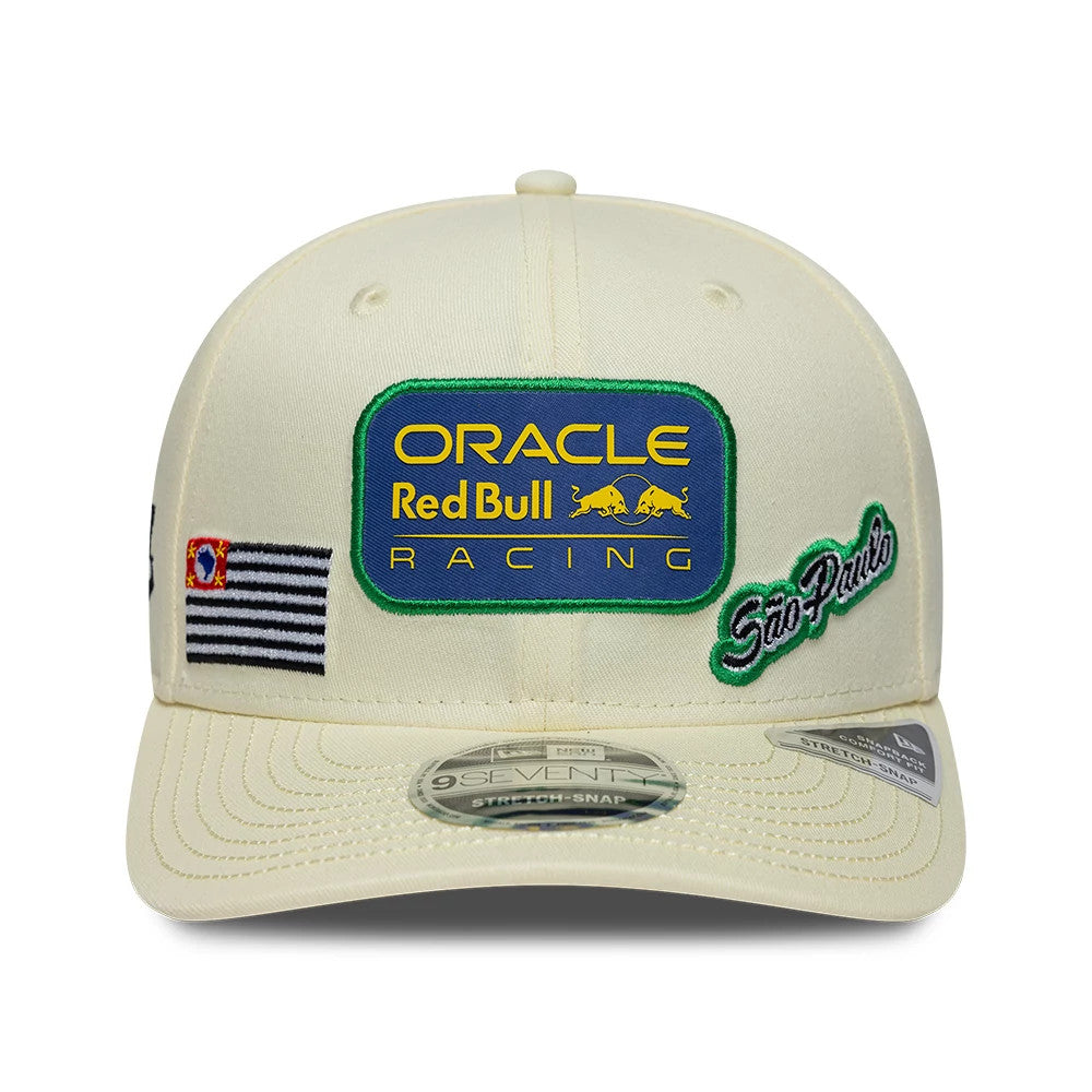 Red Bull Racing Brazil Race Special Team Cream New Era 9SEVENTY Stretch Snap Adjustable Cap, front view showing a large blue and yellow embroidered Oracle Red Bull Racing patch, a black and white striped flag.