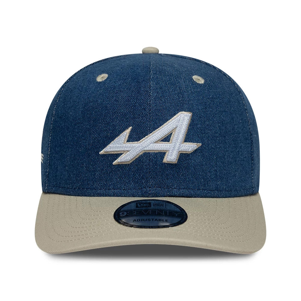 Alpine Racing Austin Race Special Denim Navy New Era 9SEVENTY Stretch Snap Adjustable Cap, front view showing the white embroidered A logo on the denim navy crown, beige visor and centre-placed 9SEVENTY size sticker.