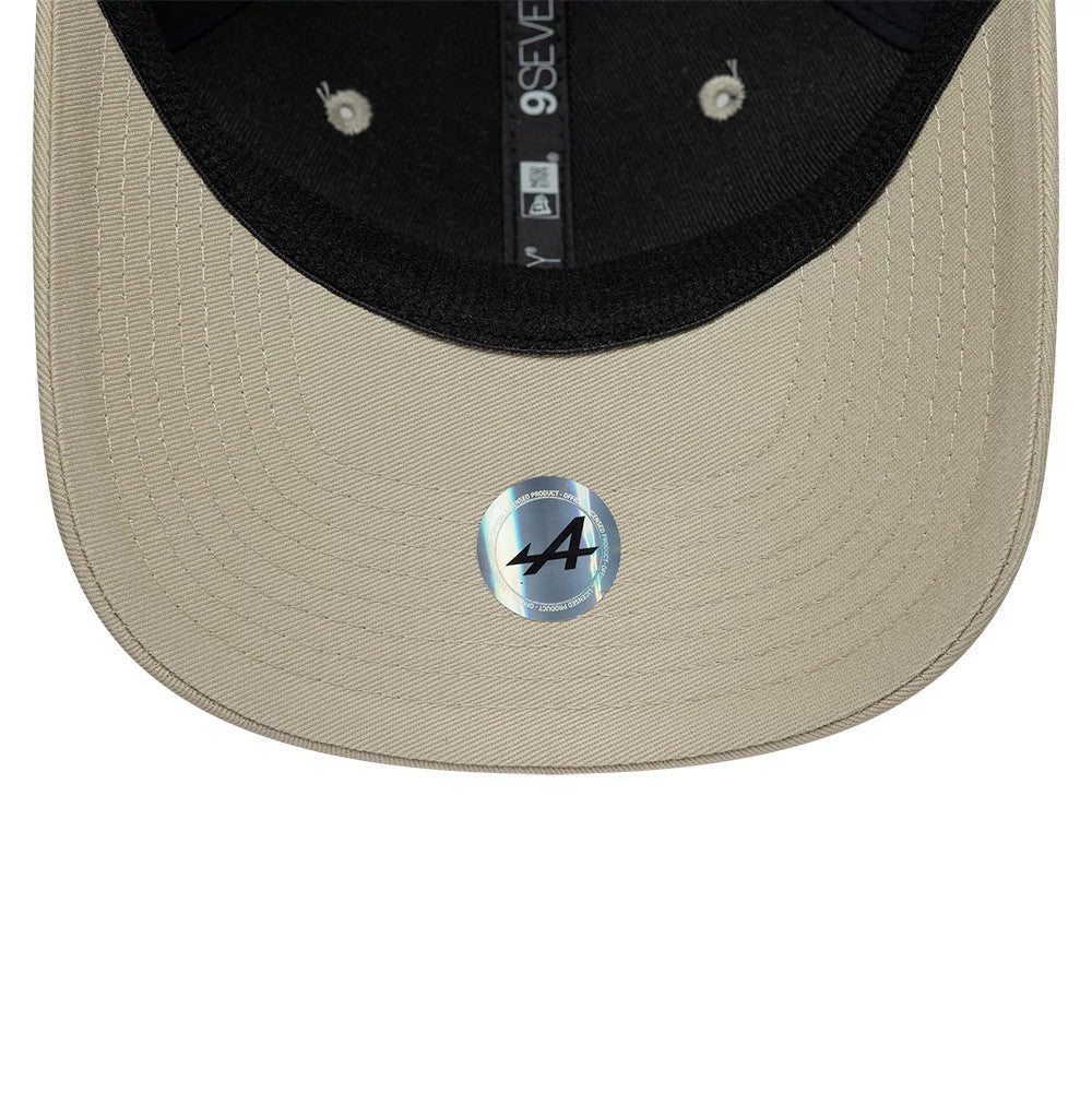 Alpine Racing Austin Race Special Denim Navy New Era 9SEVENTY Stretch Snap Adjustable Cap, inside view showing the black sweatband, the grey taping running along the seams, and the cream undervisor with an A logo sticker at the centre.
