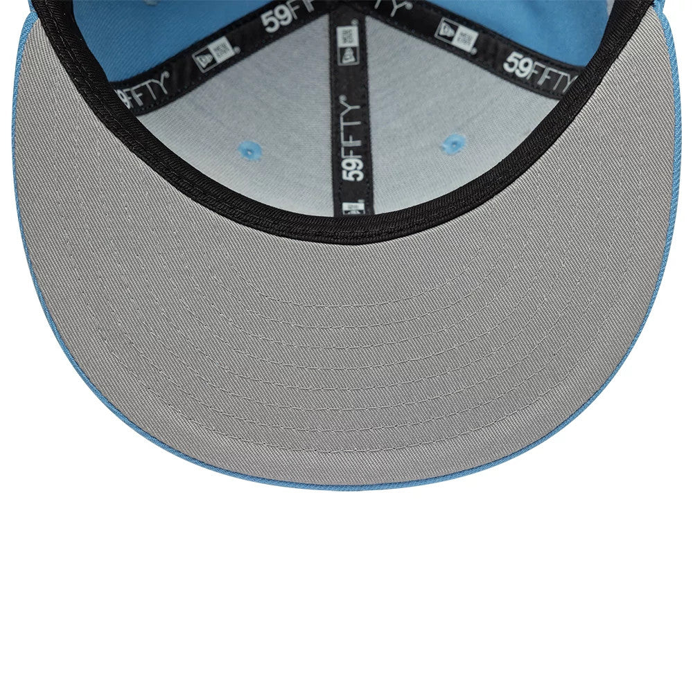 New Era Faux Pearl Cloud Pastel Blue 59FIFTY Fitted Cap, inside view showing the grey undervisor, black sweatband with 59FIFTY branding, and blue interior panels with matching blue eyelets, creating a detailed look beneath the cap.