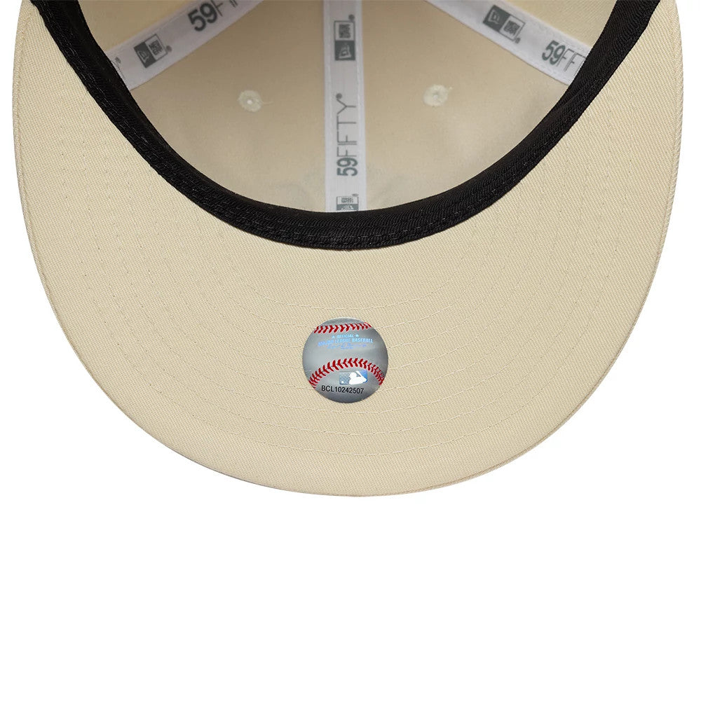 New York Yankees MLB Baseball Stitch Cream Retro Crown New Era 59FIFTY Fitted Cap, inside view showing grey sweatband, cream undervisor with a baseball stitch-themed sticker, and branded taping along the crown seams.