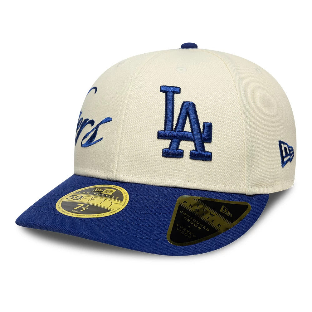 LA Dodgers MLB Side Script Cream New Era Low Profile 59FIFTY Fitted Cap, three-quarter view showing a raised blue embroidered LA logo on the front panel, Dodgers script on cream fabric, and a blue visor with a gold 59FIFTY size sticker.