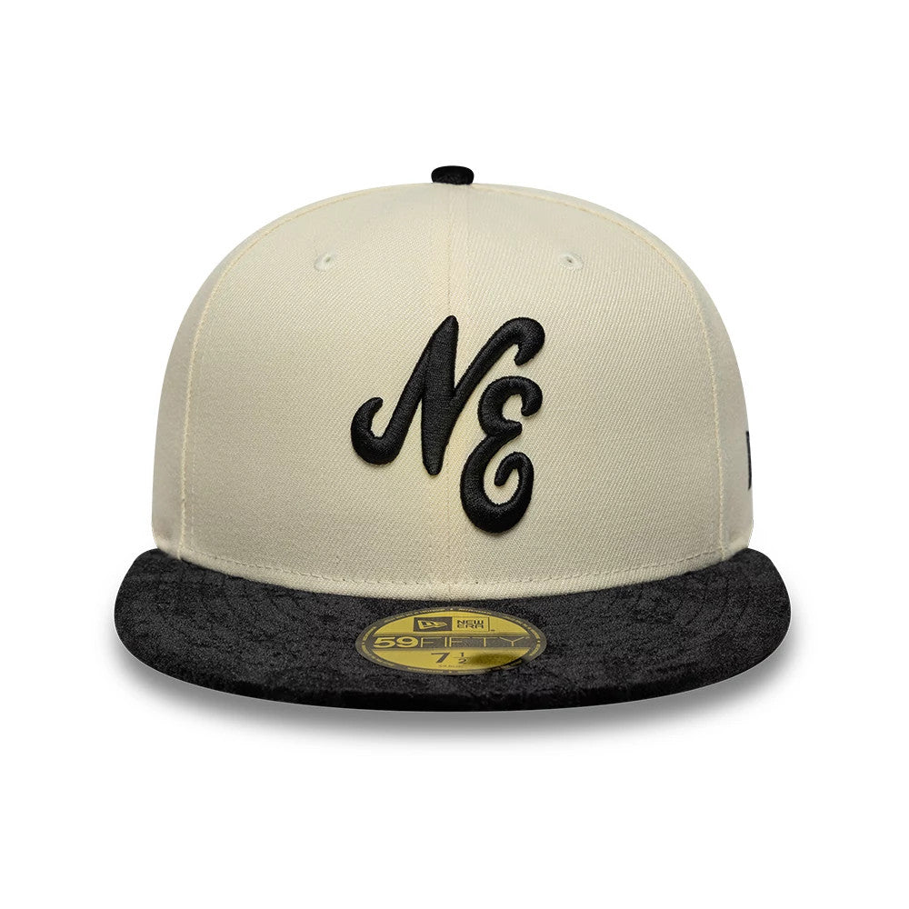 New Era Paisley Visor Light Beige 59FIFTY Fitted Cap, front view showing the raised black embroidered NE logo on the light beige crown with a paisley-patterned black visor and gold 59FIFTY size sticker on the visor.