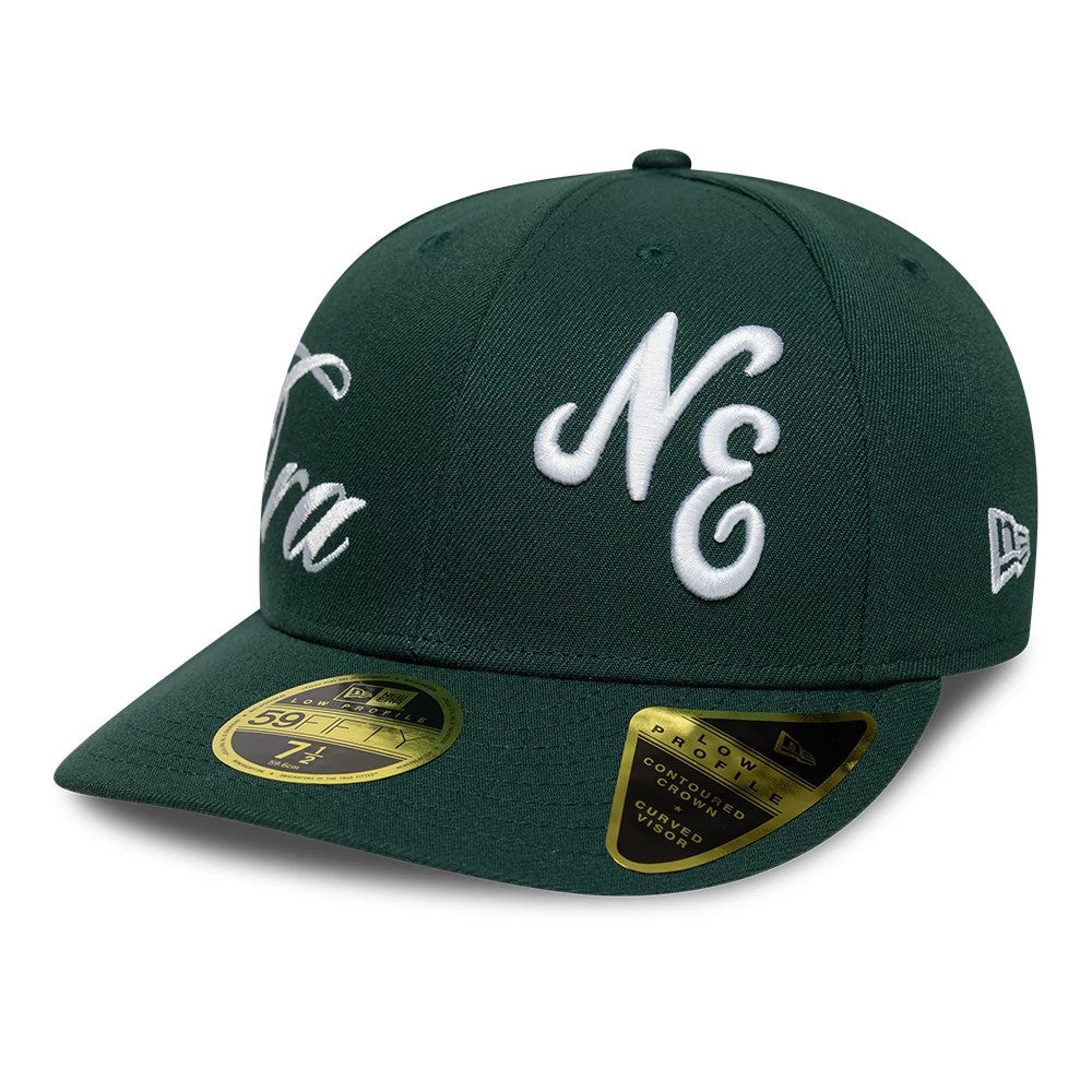 New Era Side Script Dark Green Low Profile 59FIFTY Fitted Cap, three-quarter view showing white embroidered NE lettering on the front panel, a matching New Era flag logo on the left side, and a gold 59FIFTY size sticker on the dark green visor.