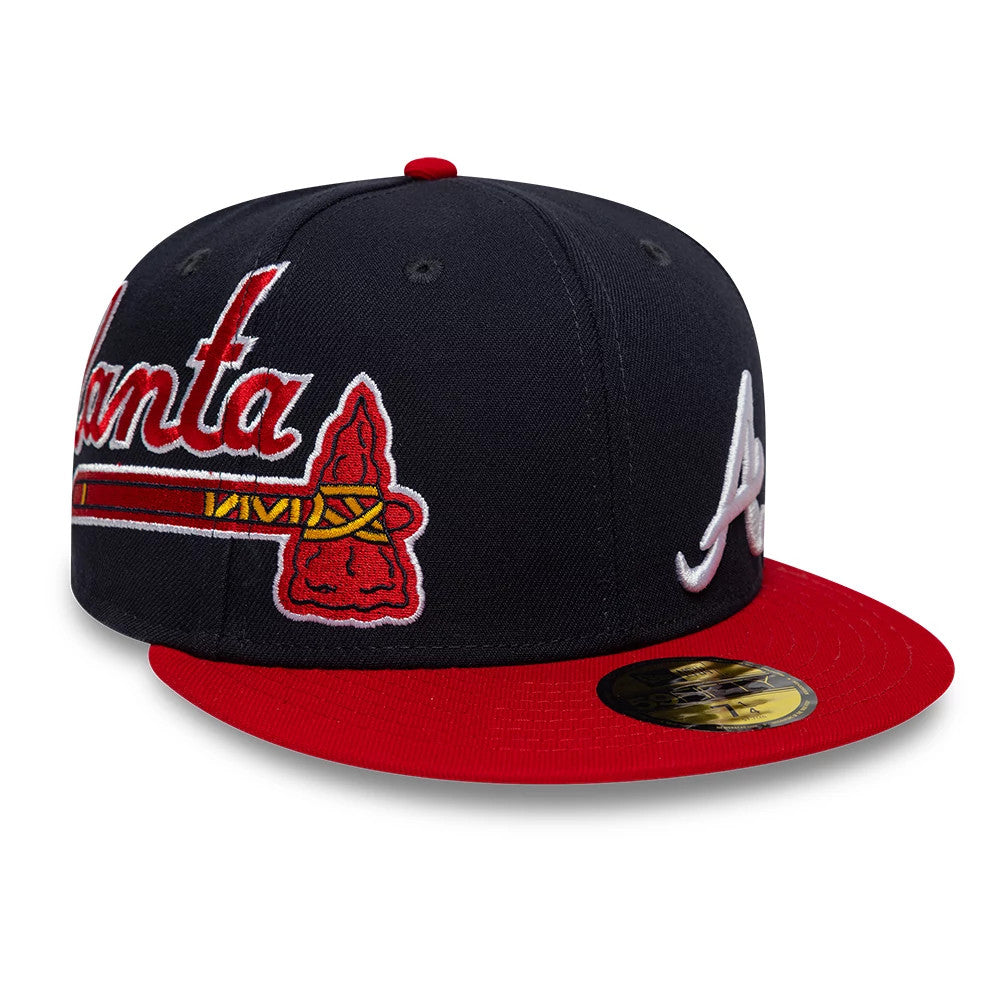 Atlanta Braves MLB Multi Logo Satin Lined Navy New Era 59FIFTY Fitted Cap, three-quarter view showcasing a raised white embroidered A logo on the navy front panel, an Atlanta script and tomahawk on the side.