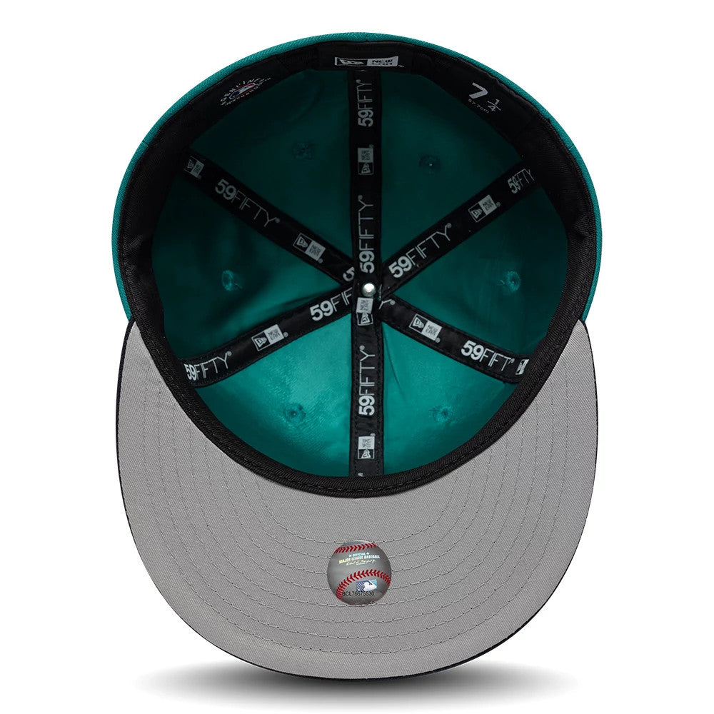 Pictured is this MLB Multi Logo Seattle Mariners 59FIFTY Fitted cap in green. 2