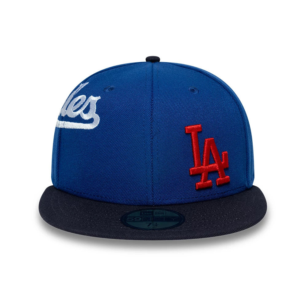 LA Dodgers MLB Multi Logo Satin Lined Blue New Era 59FIFTY Fitted Cap, front view showing a raised red embroidered LA logo on the right front panel, white script logo on the left side, and a black flat visor with a gold 59FIFTY size sticker.