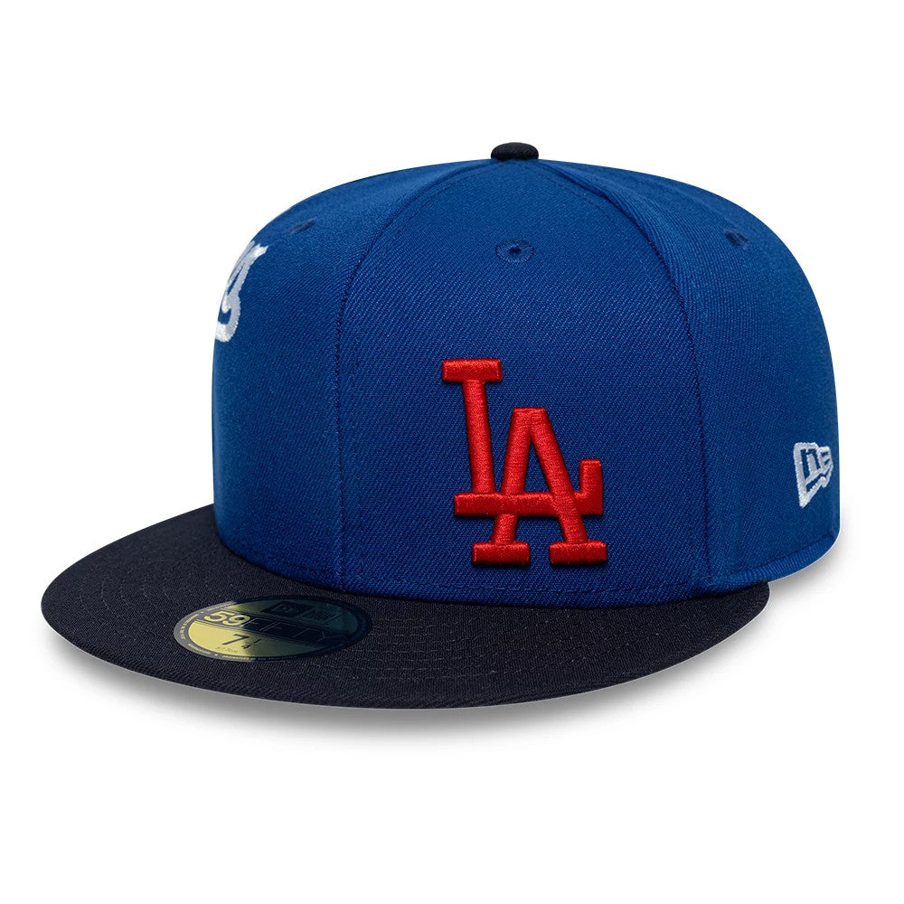 LA Dodgers MLB Multi Logo Satin Lined Blue New Era 59FIFTY Fitted Cap, front view showing the red raised embroidered LA logo on the blue front panel, a contrasting black flat visor with a gold 59FIFTY size sticker.