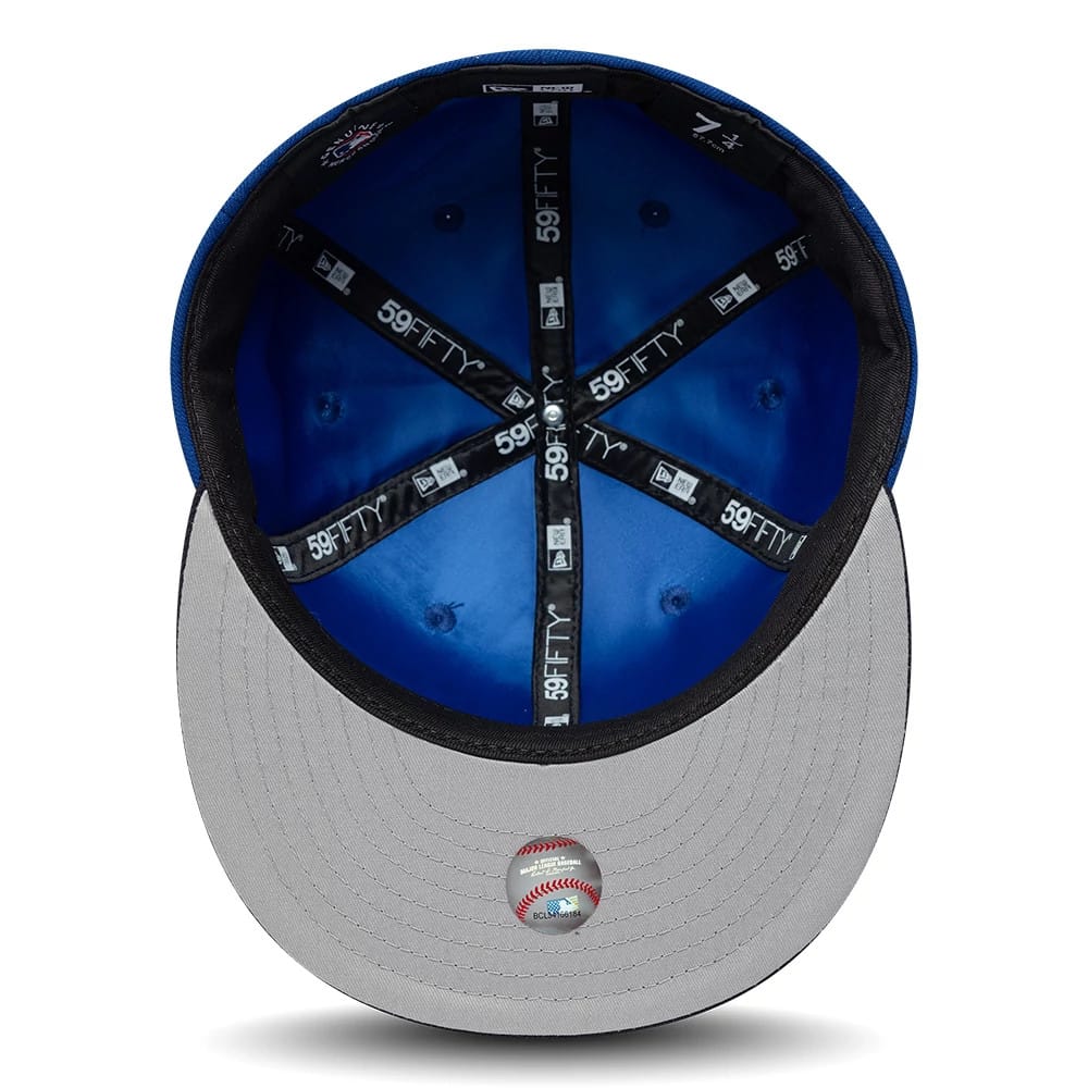 Pictured is this MLB Multi Logo LA Dodgers 59FIFTY Fitted cap in blue. 2