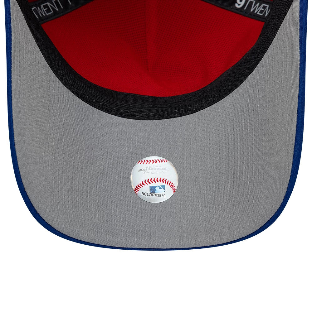 Toronto Blue Jays MLB Panel Blue New Era 9TWENTY A-Frame Adjustable Cap, inside view showing a grey undervisor with a baseball-shaped sticker, red line taping against a bright red interior, and the black sweatband edge along the visor.