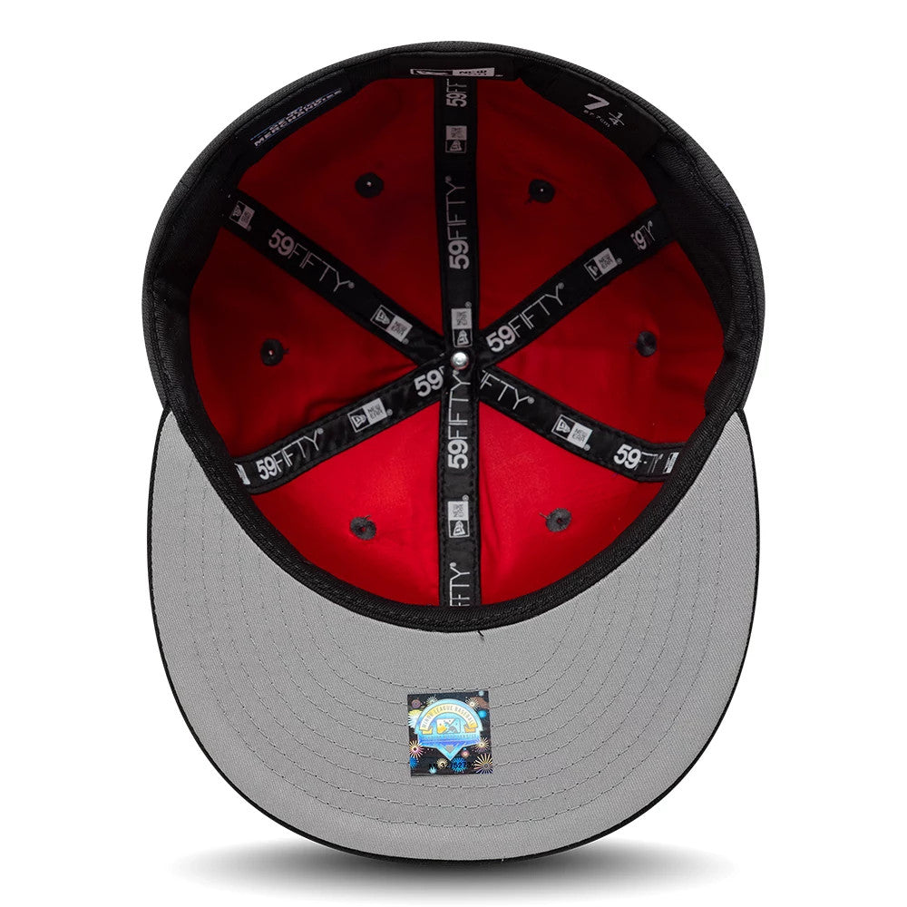 Vancouver Canadians MiLB Multi Logo Satin Lined Charcoal New Era 59FIFTY Fitted Cap, inside view showing red satin lining, black taping with repeated 59FIFTY logos, and a grey undervisor featuring a colourful size sticker near the edge.