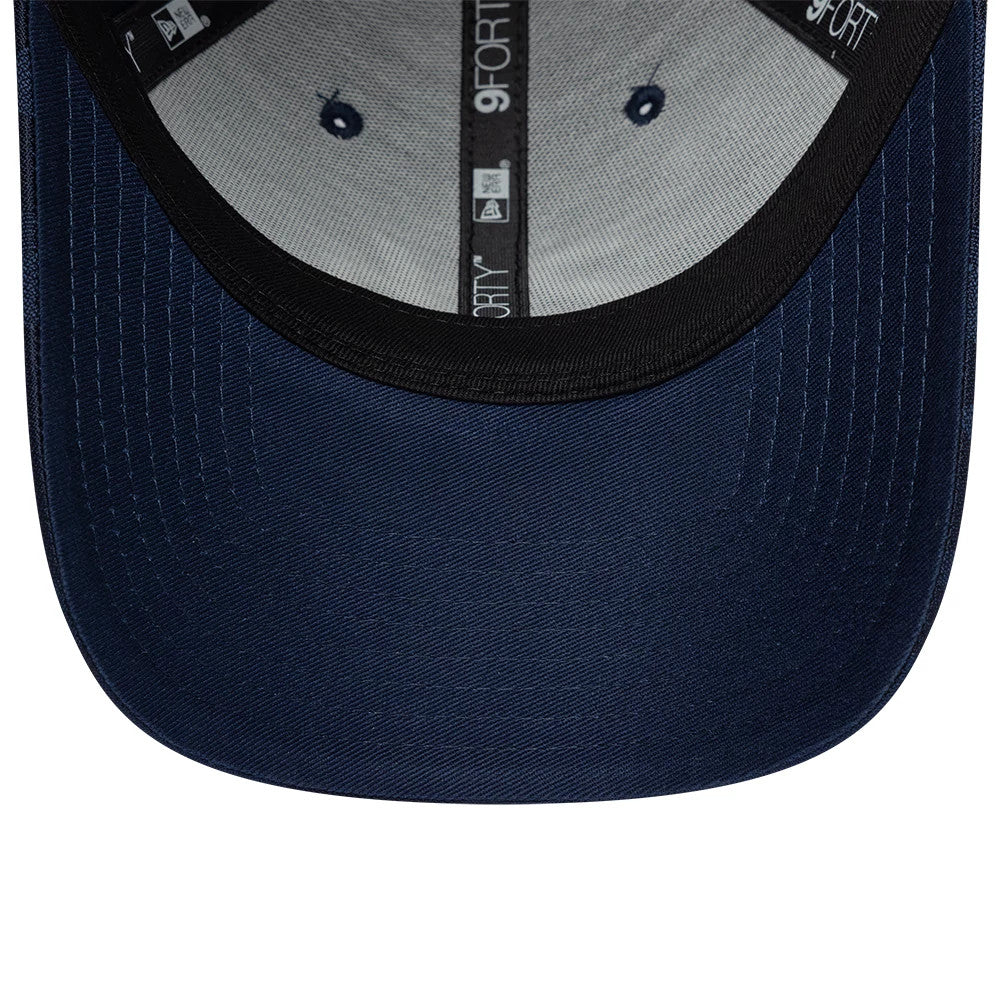24HR Le Mans Camo Dark Blue New Era 9FORTY Adjustable Cap, inside view showing dark blue undervisor, black sweatband with repeating 9FORTY logo on the taping, and two navy eyelets on the inner grey panels.
