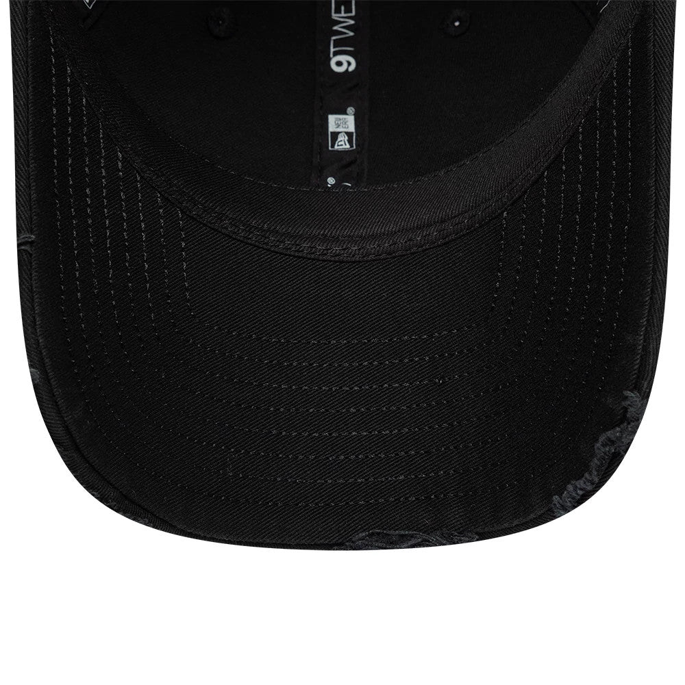 24HR Le Mans Washed Graphic Black New Era 9TWENTY Adjustable Cap, inside view showing the black undervisor, black taping with white logos running along the centre, and the embroidered eyelets, all contributing to the cap's distinct style.