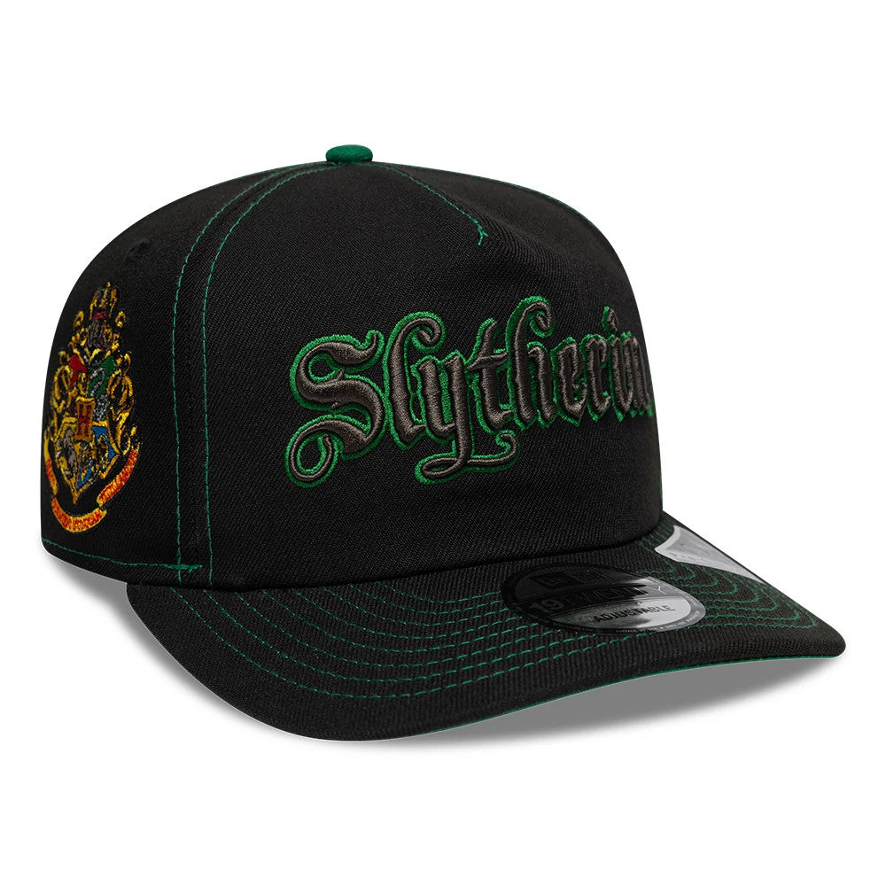Harry Potter Slytherin Black New Era 19TWENTY Adjustable Cap, front view showing raised green Slytherin script embroidery on the black crown, a detailed house crest embroidered on the side panel, and the black visor with green stitching.