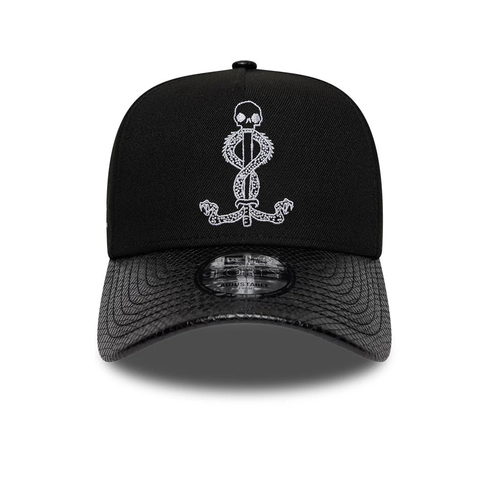 Harry Potter Slytherin Black New Era 9FORTY A-Frame Adjustable Cap, front view showing a white embroidered Slytherin serpent skull emblem on the structured black crown, with a textured black visor and a 9FORTY size sticker.