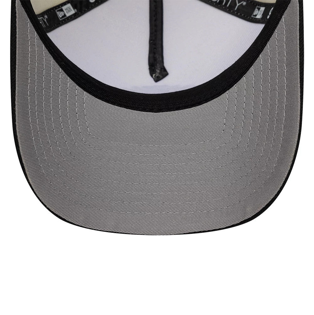 Harry Potter Hogwarts White & Black New Era 9FORTY A-Frame Adjustable Cap, inside view showing a light grey undervisor with black edging, white sweatband contrasting with black taped seams, and detailed stitching for a clean finish.