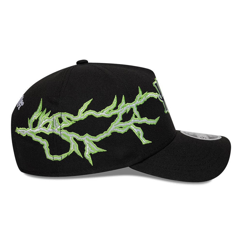 Harry Potter Duel Black New Era 9FORTY M-Crown A-Frame Adjustable Cap, side view showcasing a vivid green lightning bolt embroidery along the black structured crown, with a 9FORTY size sticker on the curved visor.
