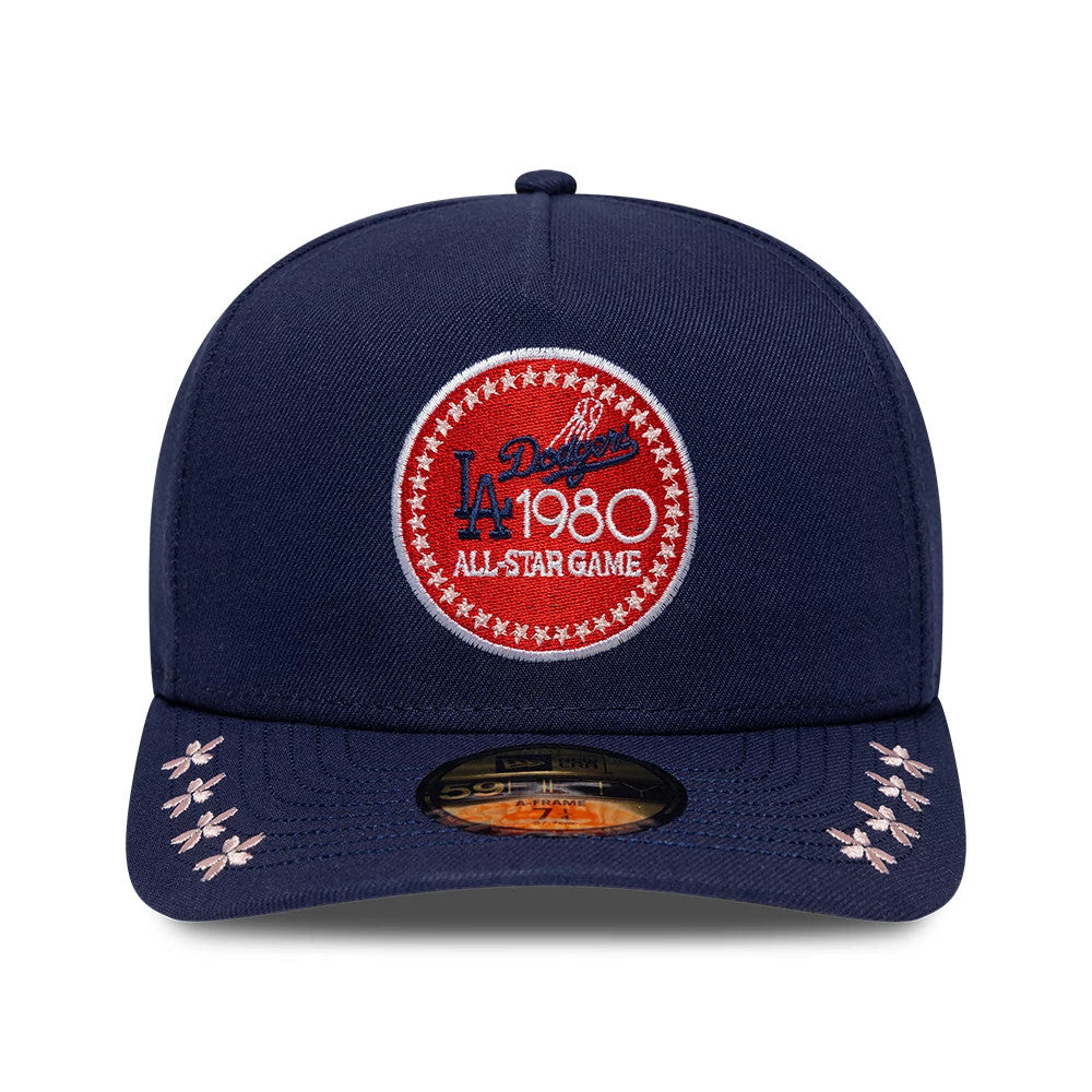 LA Dodgers MLB All Star Game Navy New Era 59FIFTY A-Frame Fitted Cap, front view showing a large red and white circular patch with LA Dodgers and 1980 All Star Game text, a flat navy visor with pink embroidery and a gold 59FIFTY size sticker.