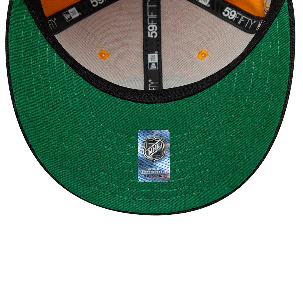 Pictured is this NHL Champions Boston Bruins 59FIFTY Fitted cap in orange & black. 2