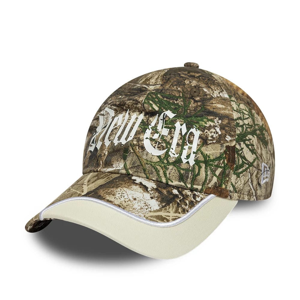 Pictured is this New Era Real Tree 9TWENTY cap in assorted print. 1