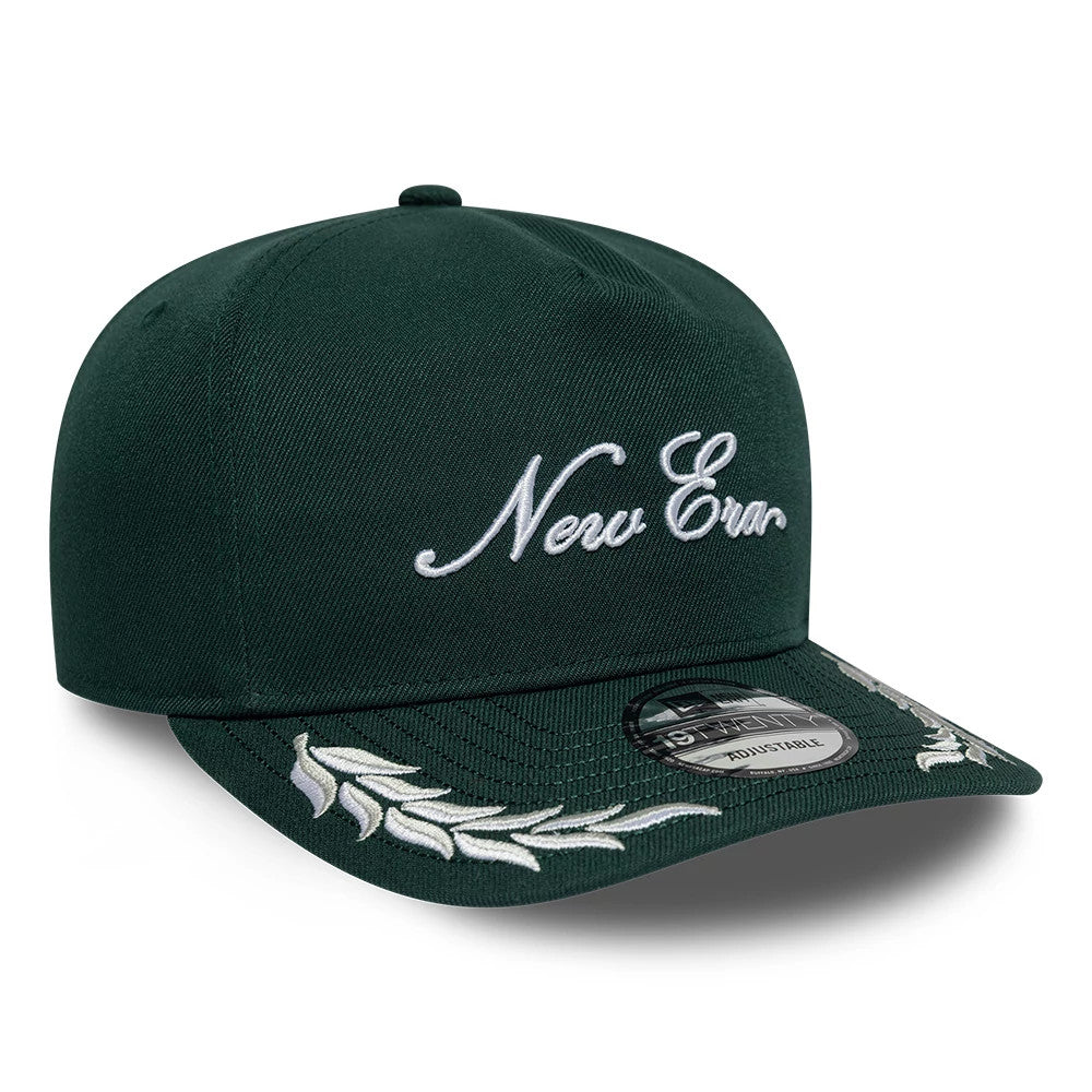 New Era Dark Green 19TWENTY Adjustable Cap, front view showing white cursive New Era embroidery on the front panel, detailed visor embroidery with laurel motifs, and a 19TWENTY size sticker on the dark green curved visor.