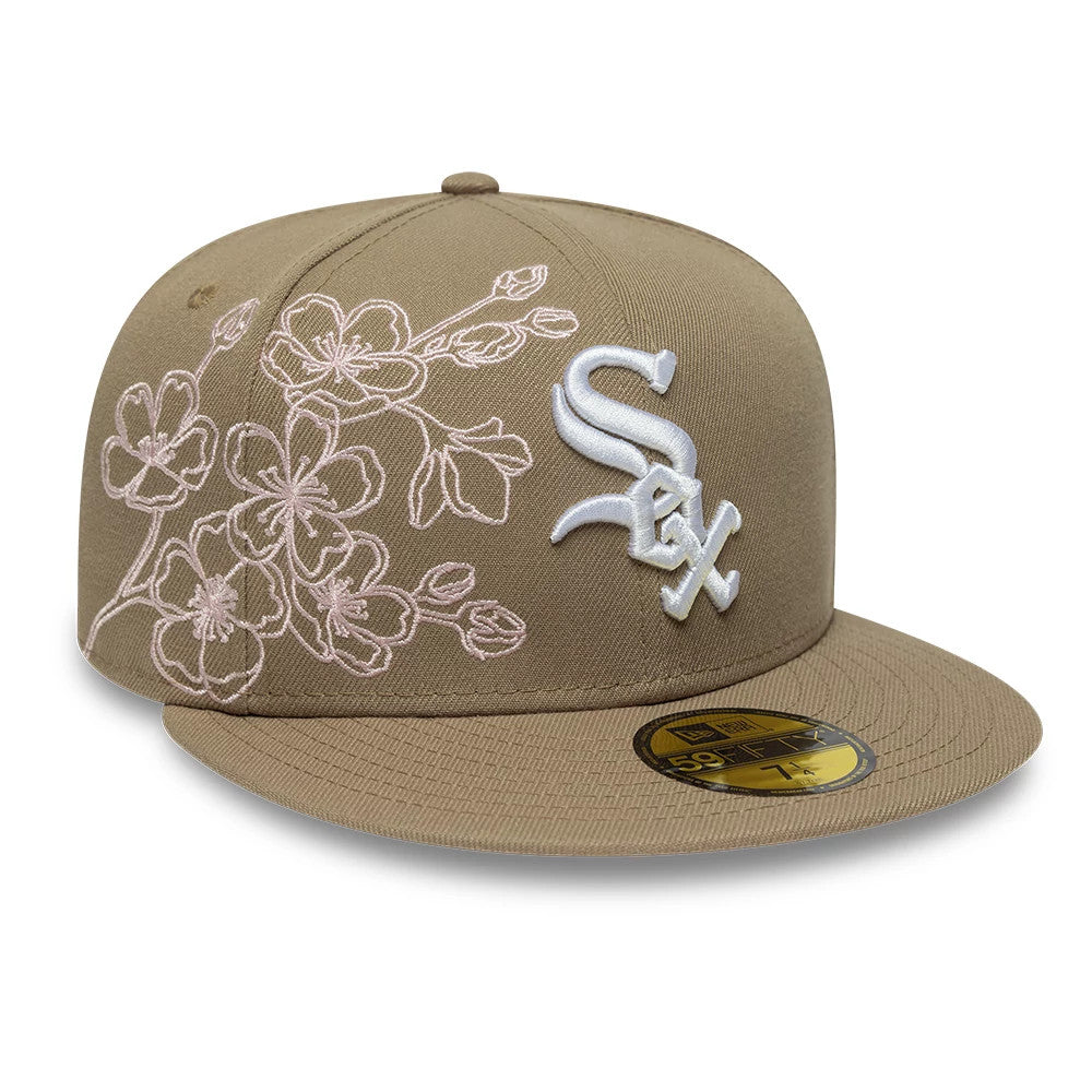 Chicago White Sox MLB Floral Outline Beige New Era 59FIFTY Fitted Cap, three-quarter view showing the white raised embroidered Sox logo on the front panel, floral embroidery in pink on the left front panel, and gold 59FIFTY size sticker on the visor.